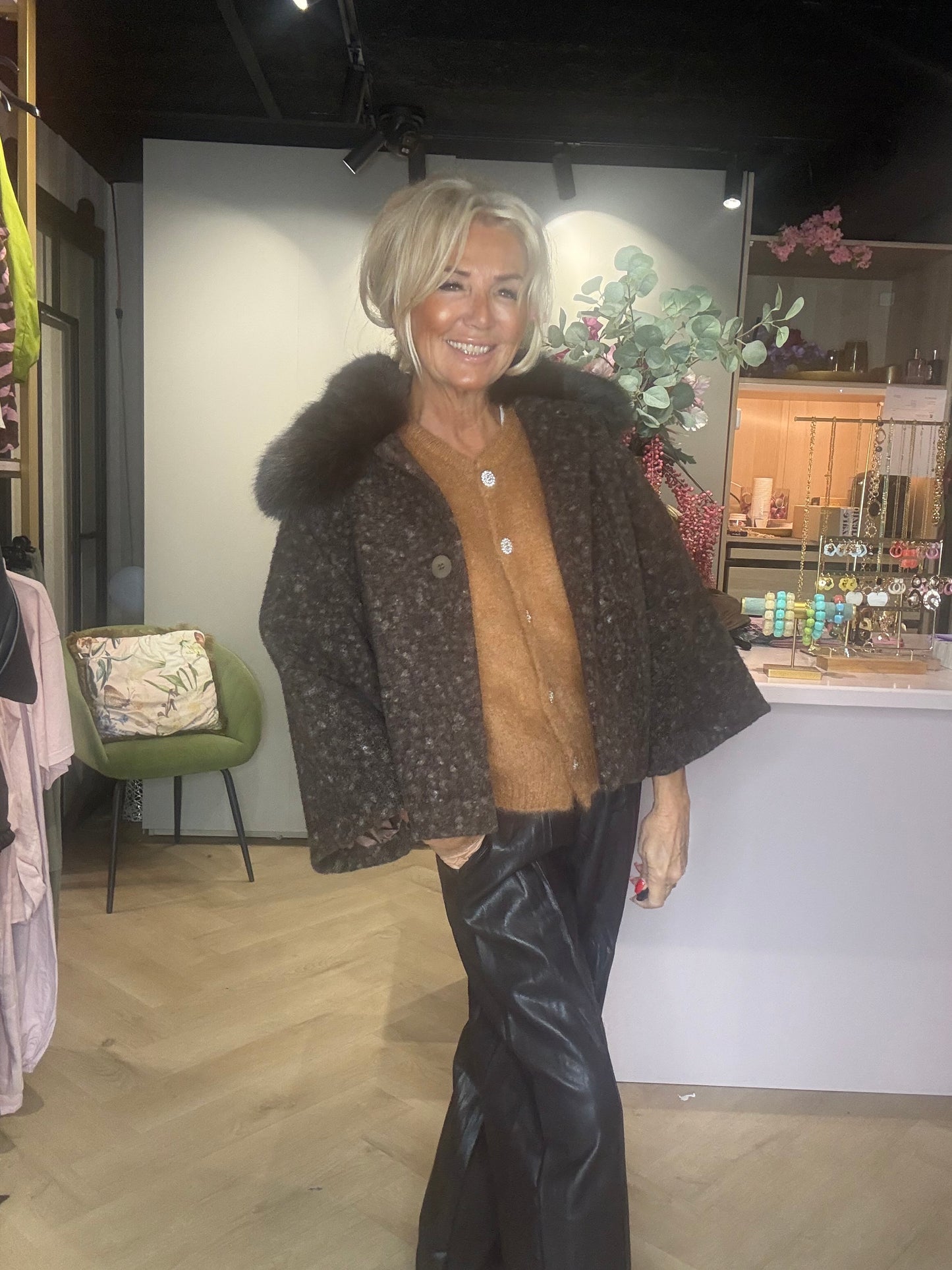Dark brown jacket with a fur collar