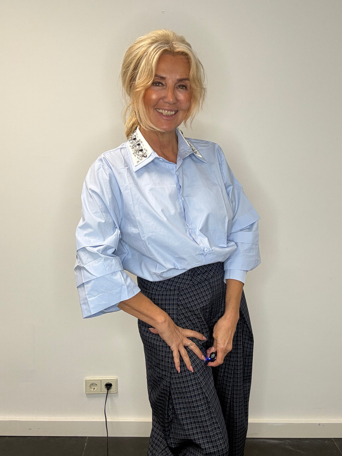 Light blue blouse with a white collar and rhinestones
