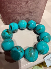 Brassard turquoise groffé Bol